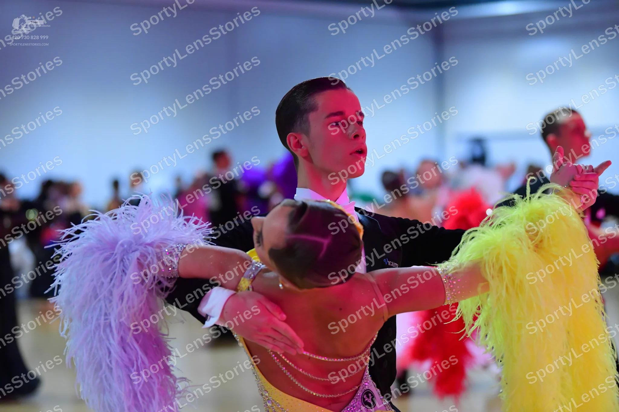 Dancesport competitor: Male dancer: black suit jacket with a white shirt