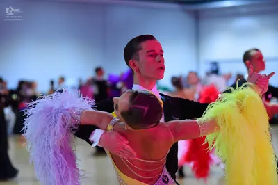 Dancesport competitor: Male dancer: black suit jacket with a white shirt