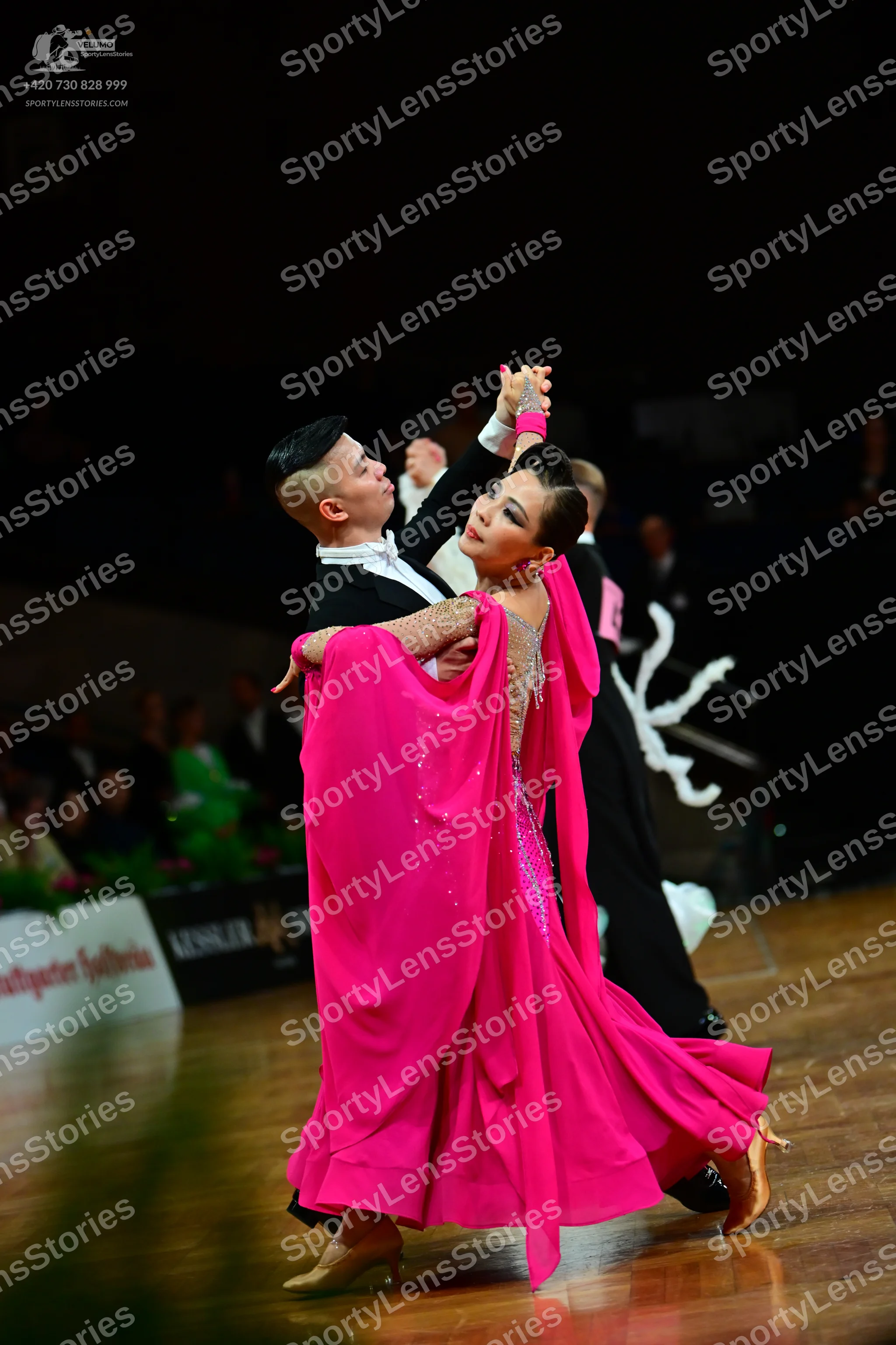 Dancesport competitor: Male dancer: black suit with a white shirt and bow tie