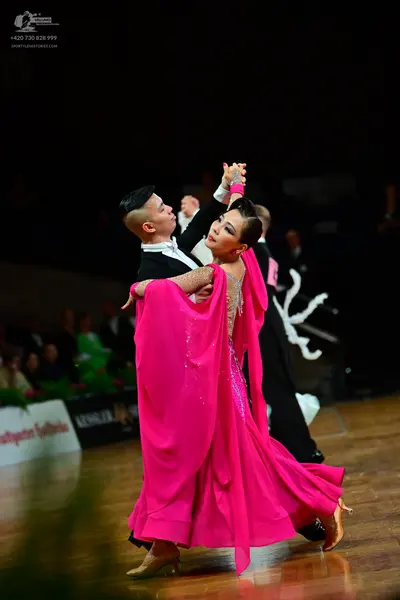 Dancesport competitor: Male dancer: black suit with a white shirt and bow tie