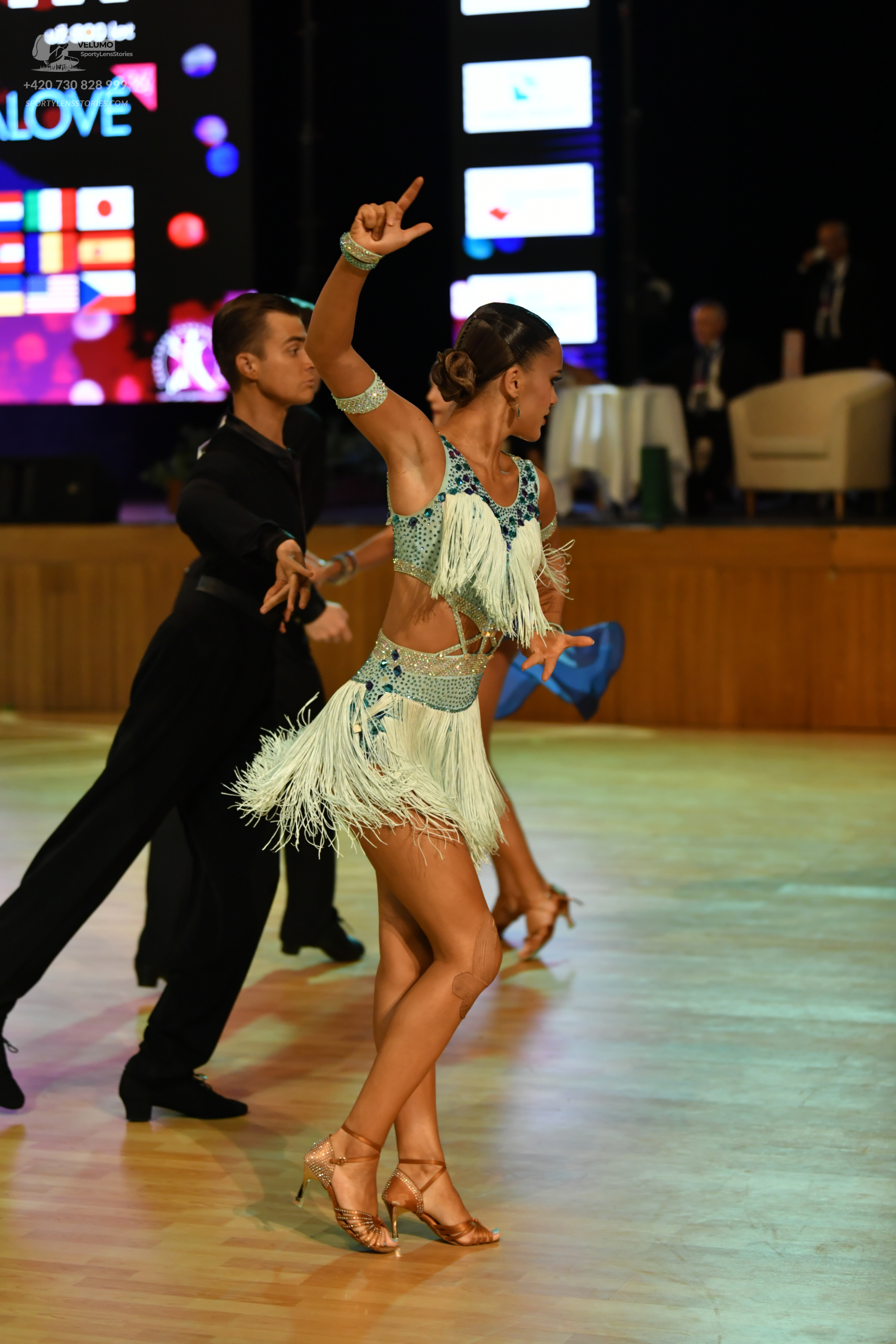 Dancesport competitor: ** Black tailored suit with sequin lapels and a black satin shirt