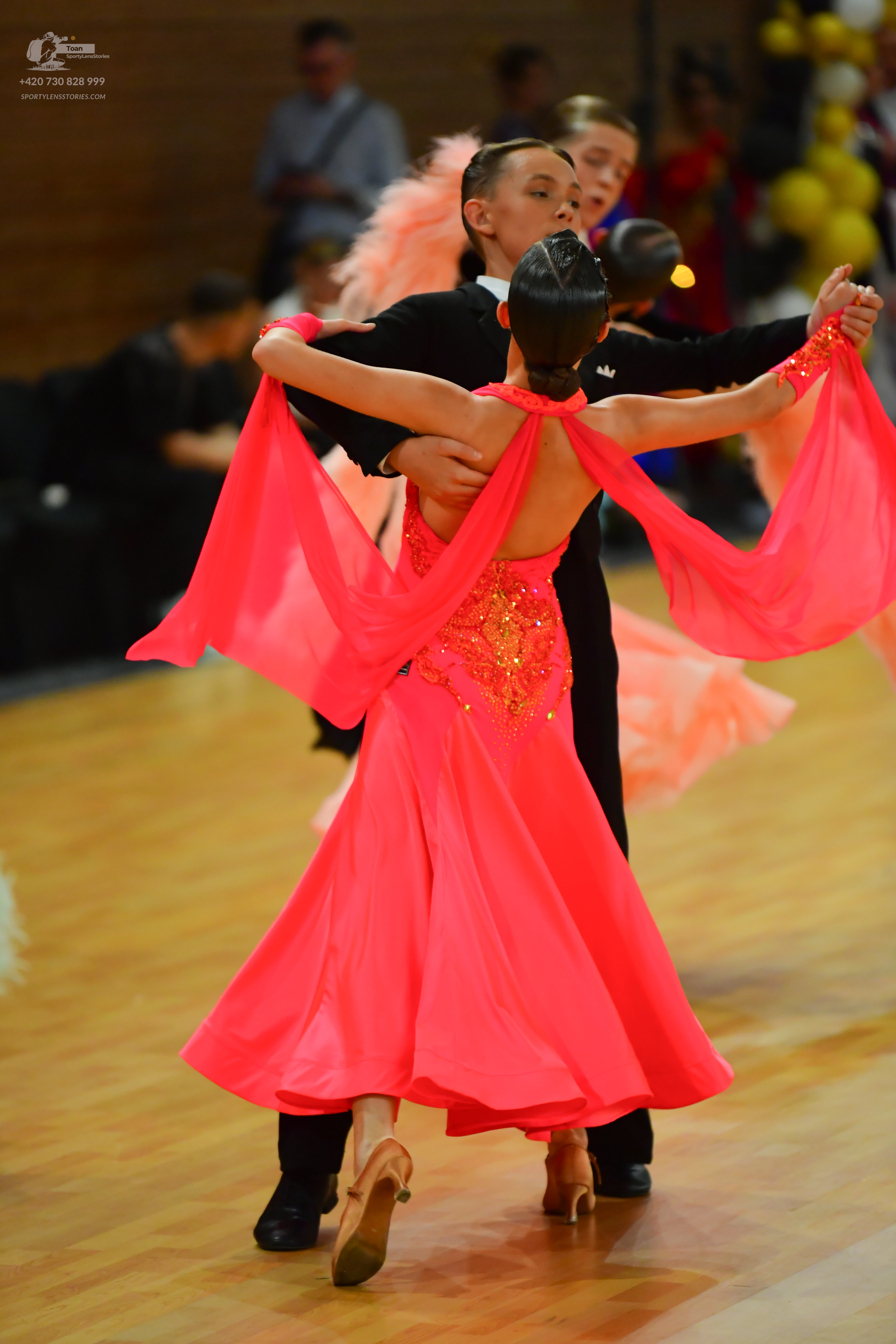 Dancesport competitor: ** Red Latin dress
*   **Fabric:** Satin (appears to be a shiny, smooth satin)
*