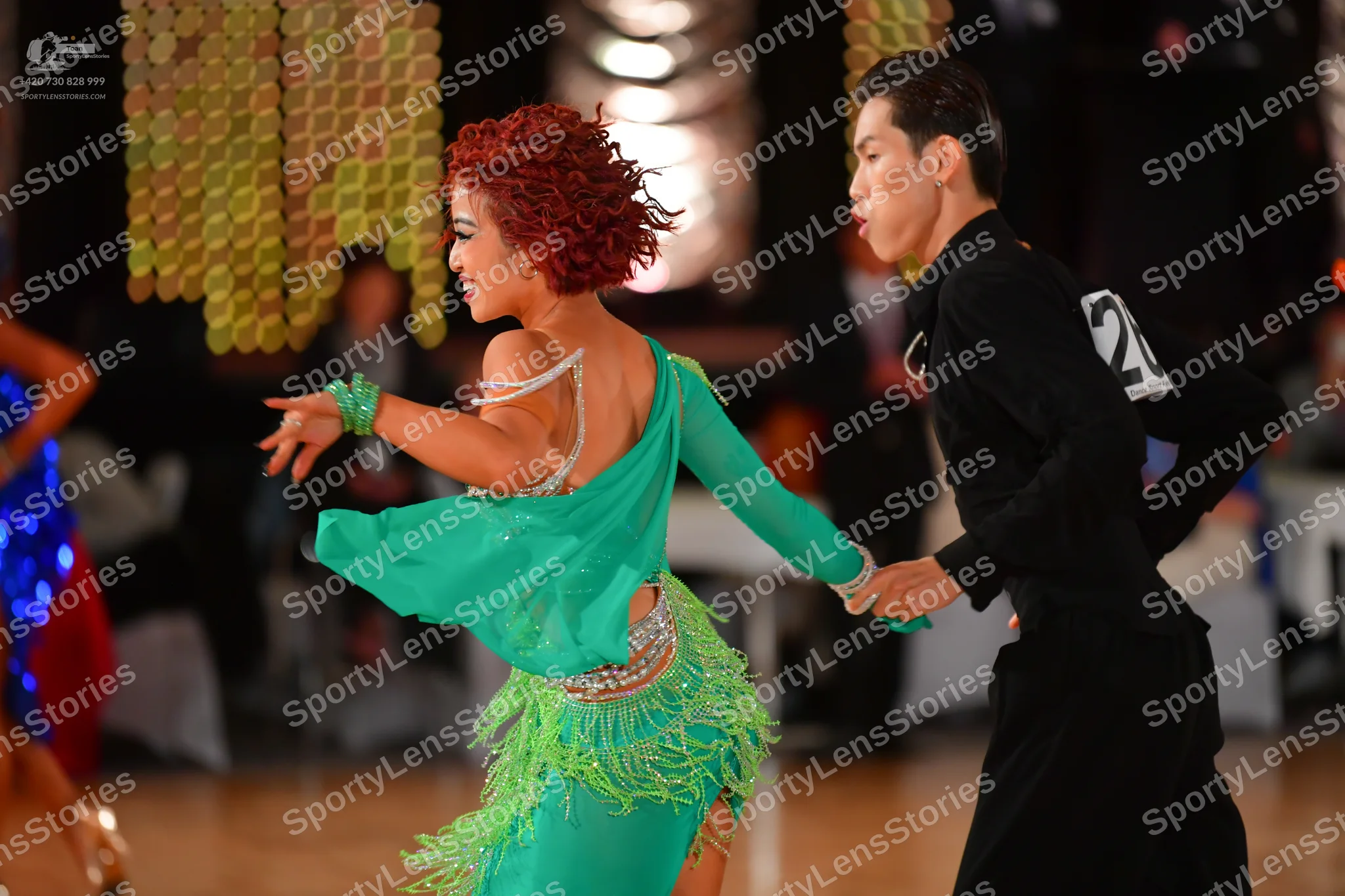 Dancesport competitor #20: Female dancer: green latin dress with fringe and silver sequin embellishments, f