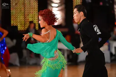 Dancesport competitor #20: Female dancer: green latin dress with fringe and silver sequin embellishments, f