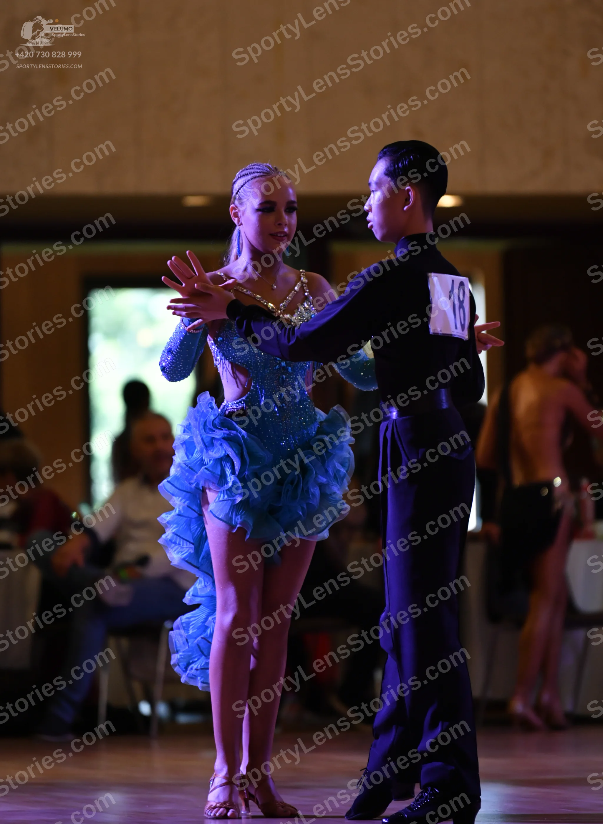 Dancesport competitor: Male:** Black suit with a subtly sequined lapel