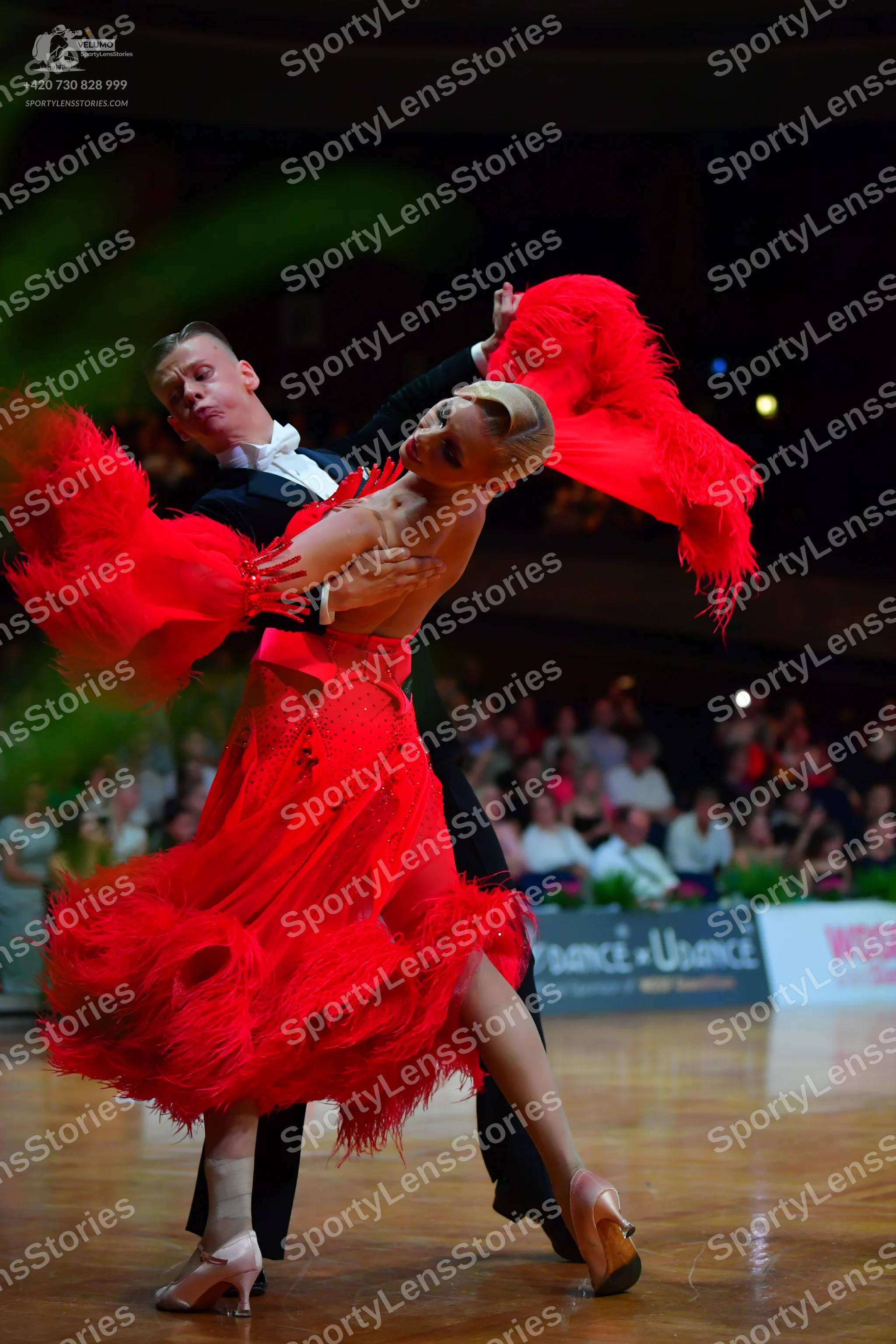 Dancesport competitor: Male dancer: black suit with a white shirt
