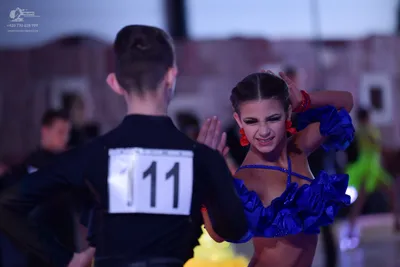 Dancesport competitor #11: Male dancer: black long-sleeved top