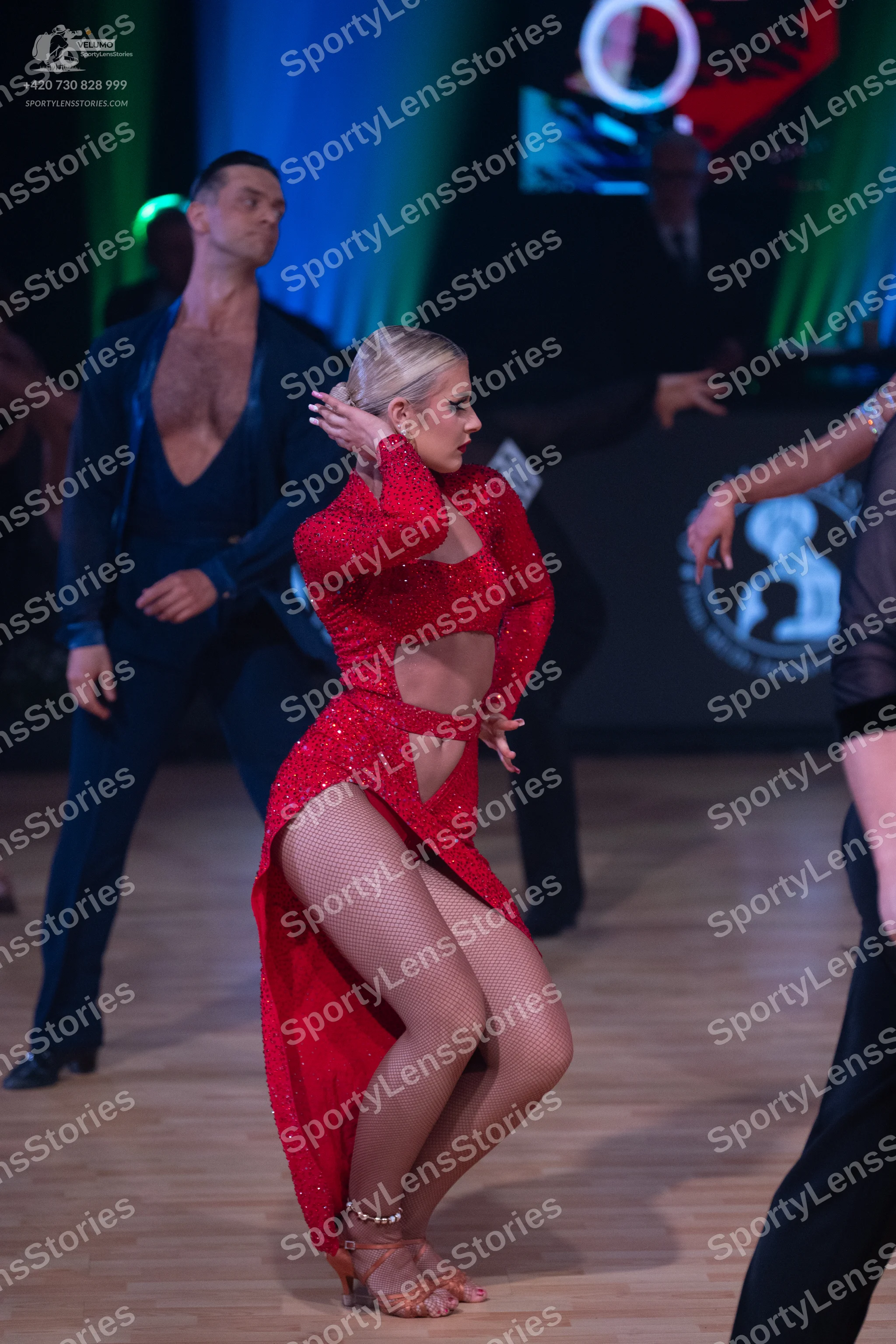 Dancesport competitor: Male dancer: dark blue long-sleeved shirt with a deep V-neck and matching trouse
