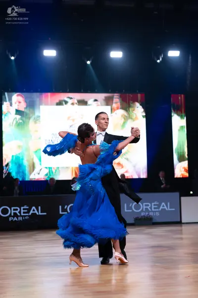 Dancesport competitor: Male dancer: black suit