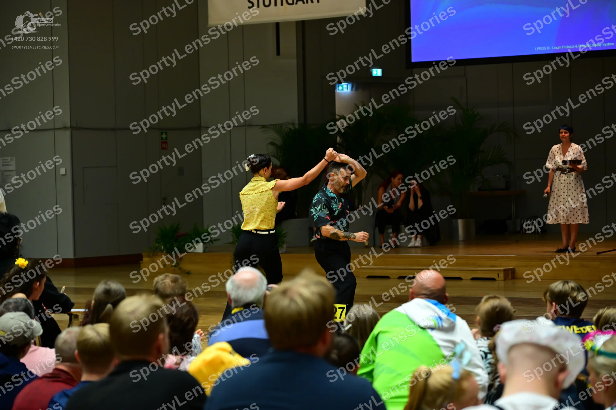 Dancesport competitor #77: Male dancer: black patterned shirt and black trousers