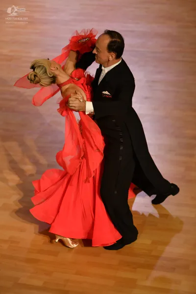 Dancesport competitor: Male dancer: black tailcoat, black trousers, white shirt, and white pocket squar