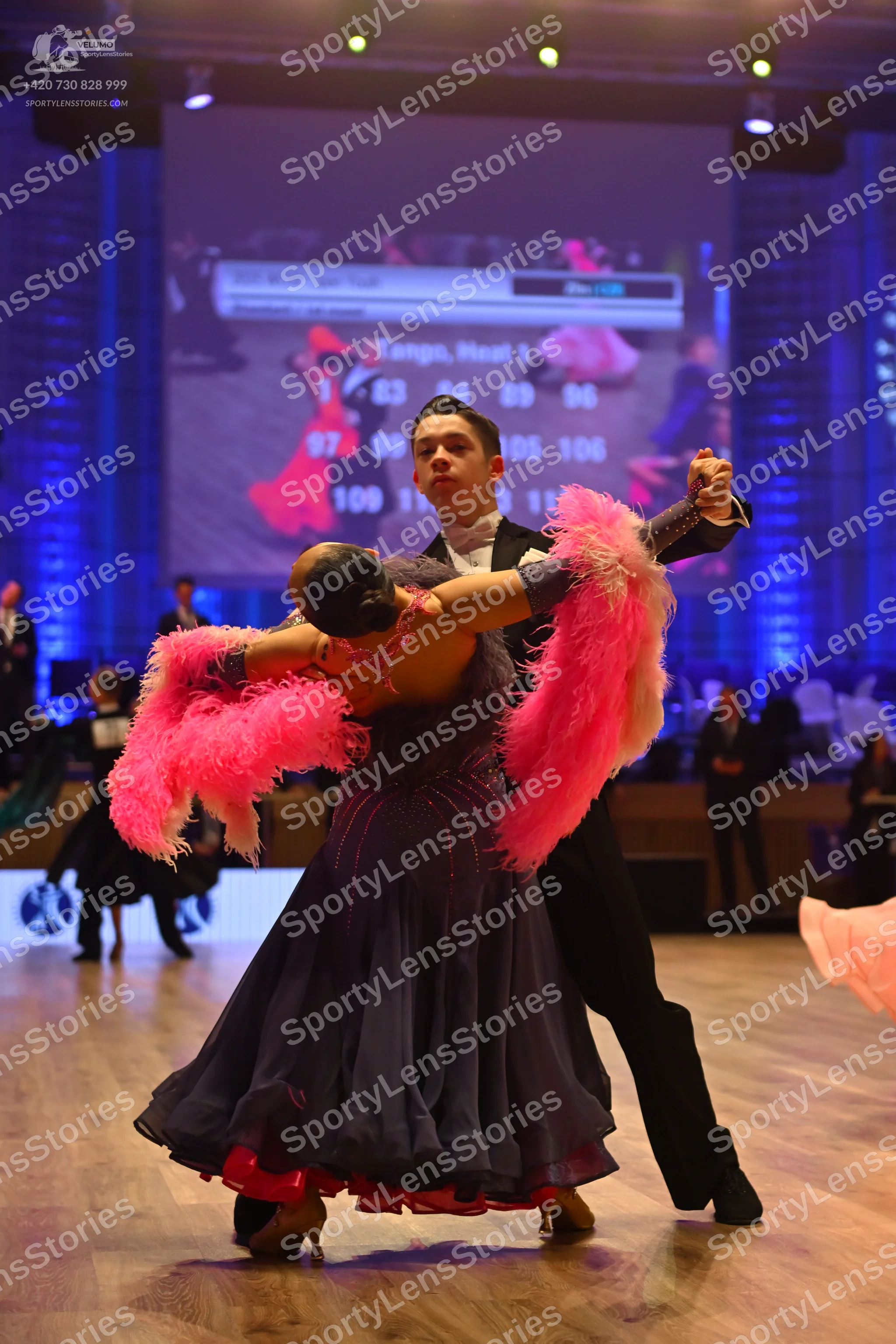 Dancesport competitor: Male dancer: black suit with a white shirt
