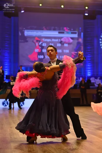 Dancesport competitor: Male dancer: black suit with a white shirt