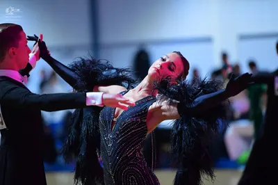 Dancesport competitor: Male dancer: black suit with white shirt and black bowtie