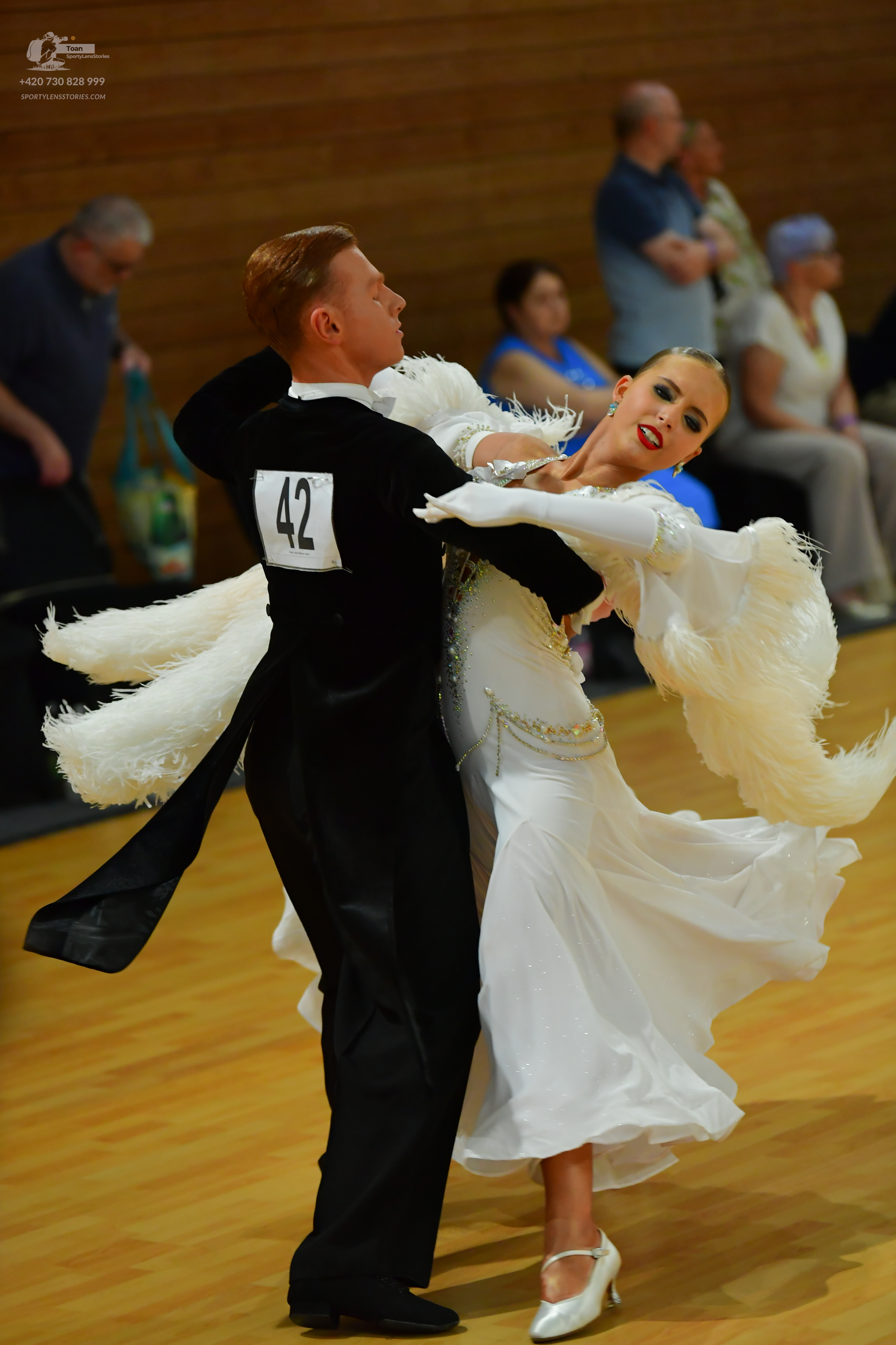 Dancesport competitor #42: Male**

*   **Color:** Black
*   **Fabric:** Tail suit with sequin lapels
*   **