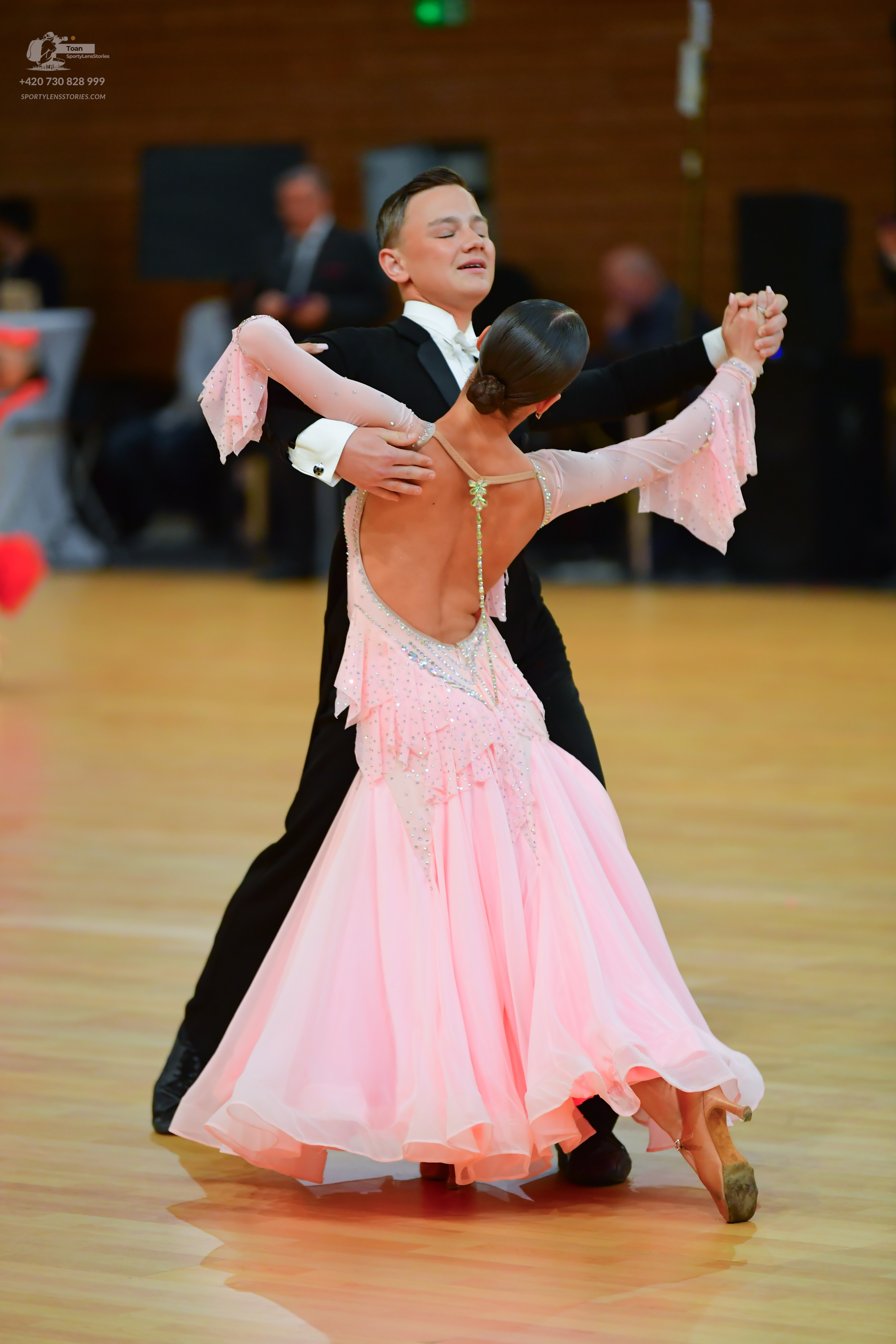 Dancesport competitor: ** Black tailsuit with silver sequin lapels and trim