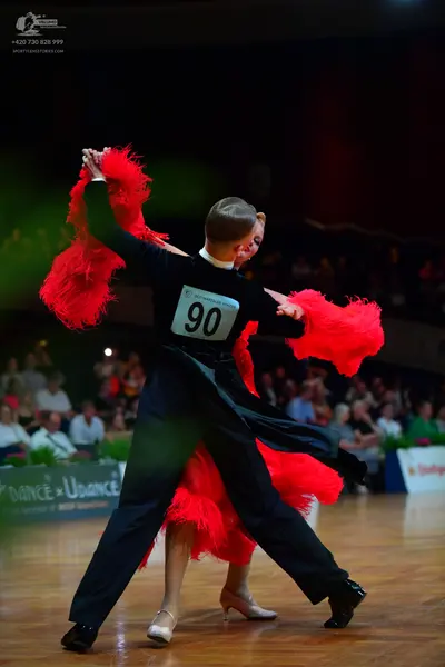 Dancesport competitor #90: Male dancer: black long-sleeved shirt and black trousers