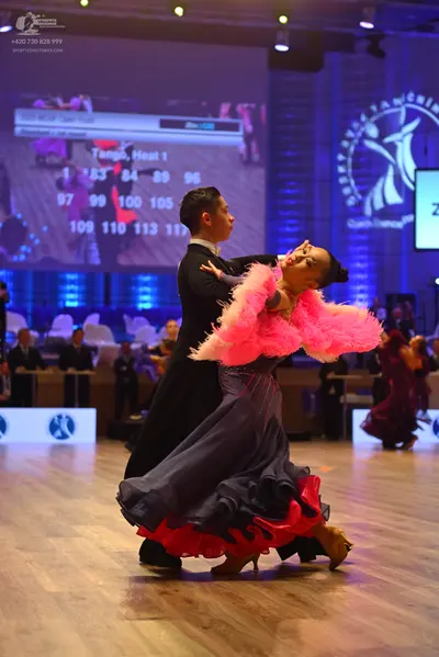 Dancesport competitor: Male dancer: black suit