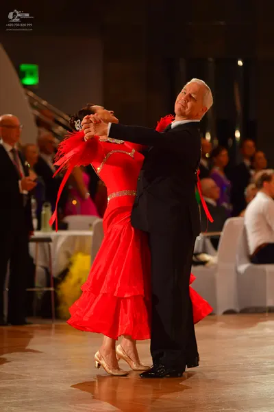 Dancesport competitor: Male dancer: black suit with a white shirt and black shoes