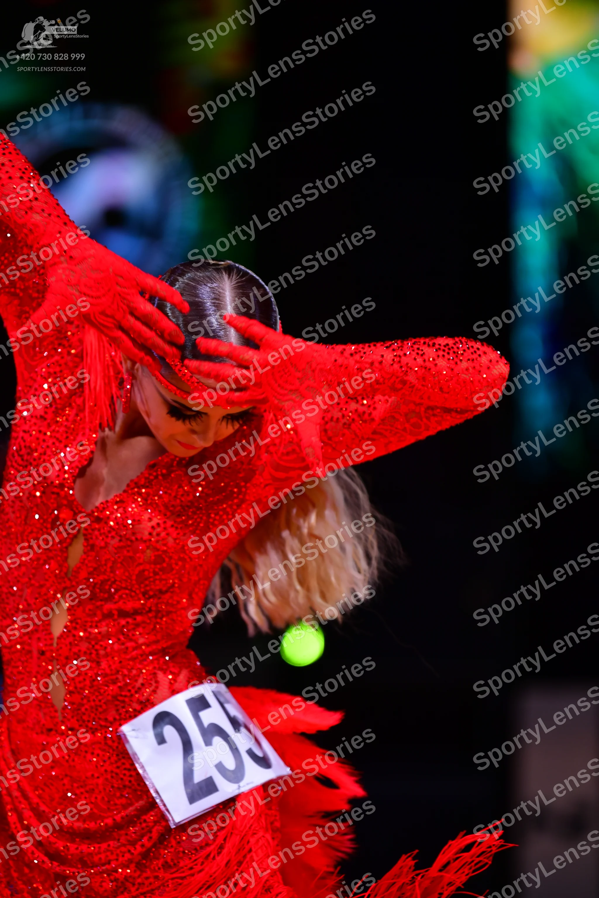 Dancesport competitor: Female dancer: red latin dress with sequins and fringe