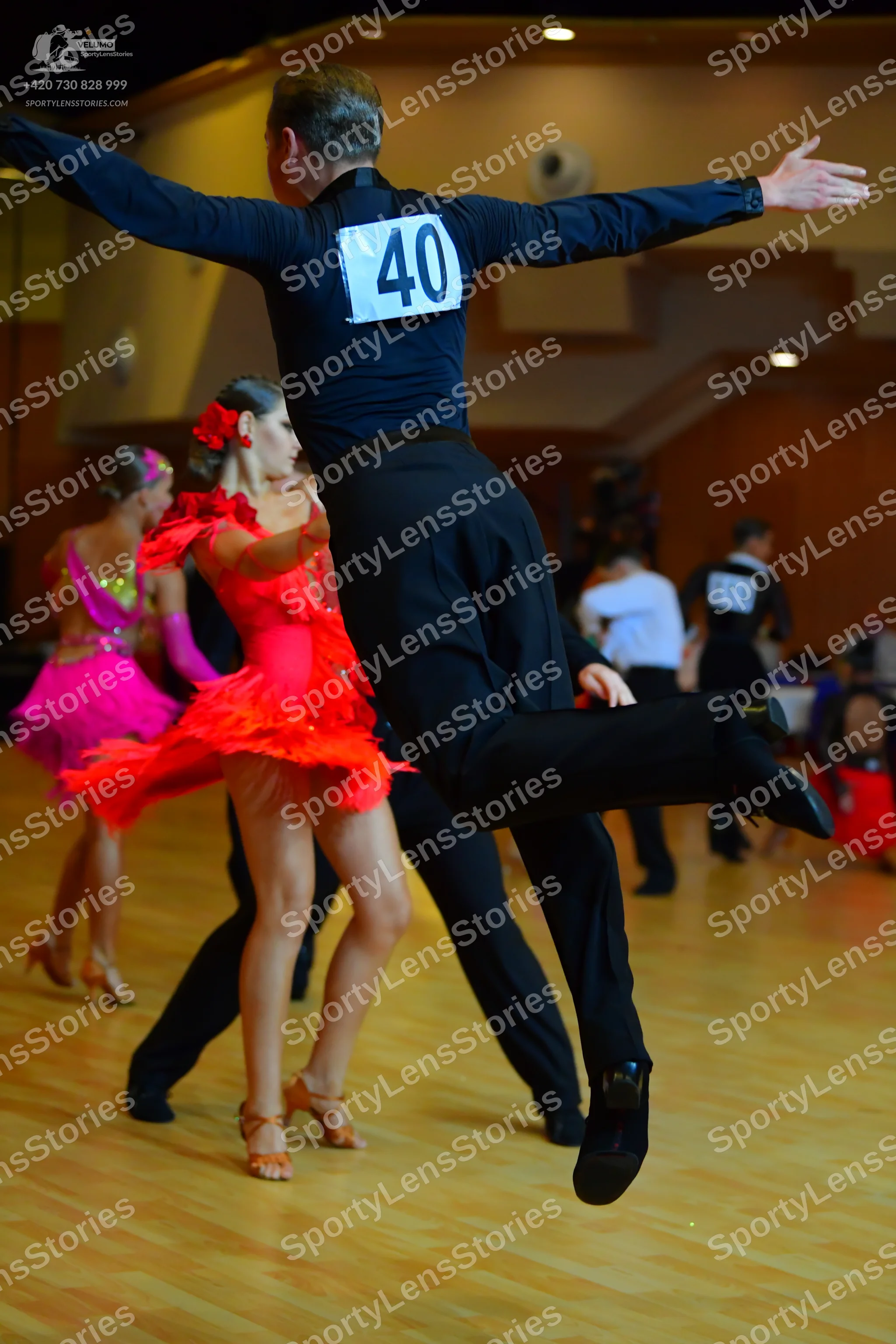 Dancesport competitor #40: Male dancer: black long-sleeved shirt and black trousers