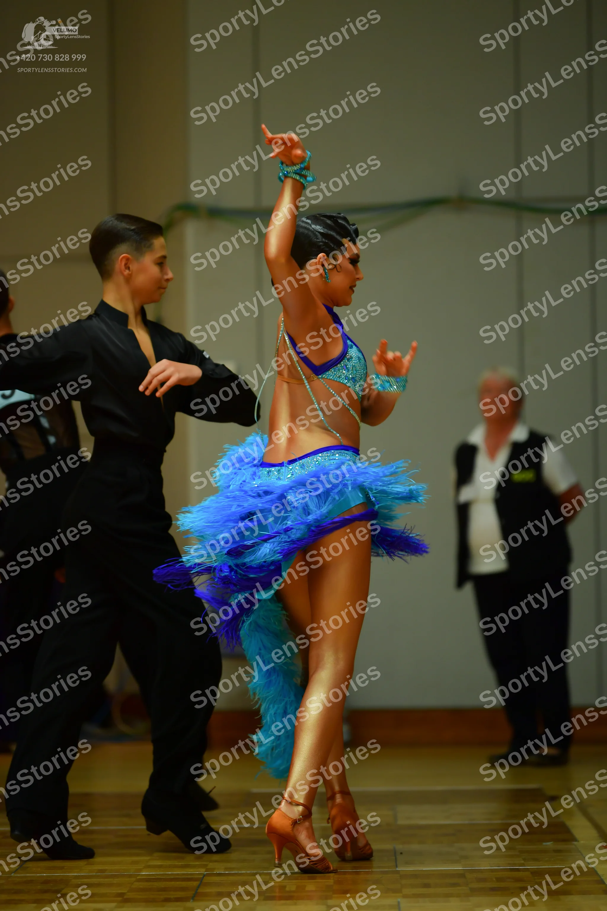 Dancesport competitor: Male dancer: black long-sleeved shirt and black trousers