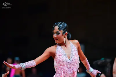 Dancesport competitor: Female dancer: light pink latin dress with heavy silver rhinestone/sequin embell