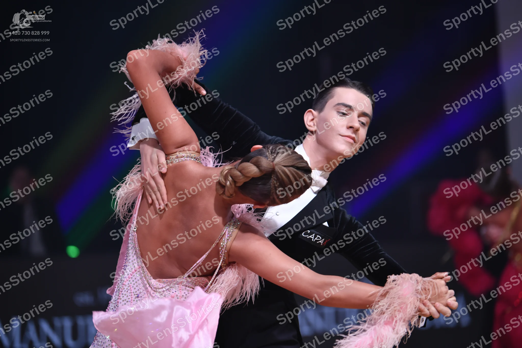 Dancesport competitor: Male dancer: black suit with white shirt and white bowtie