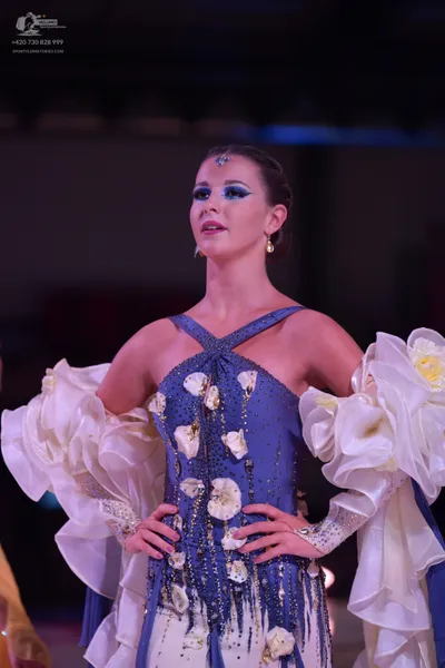 Dancesport competitor: Female dancer: periwinkle blue and white Latin dance dress with sequin embellish