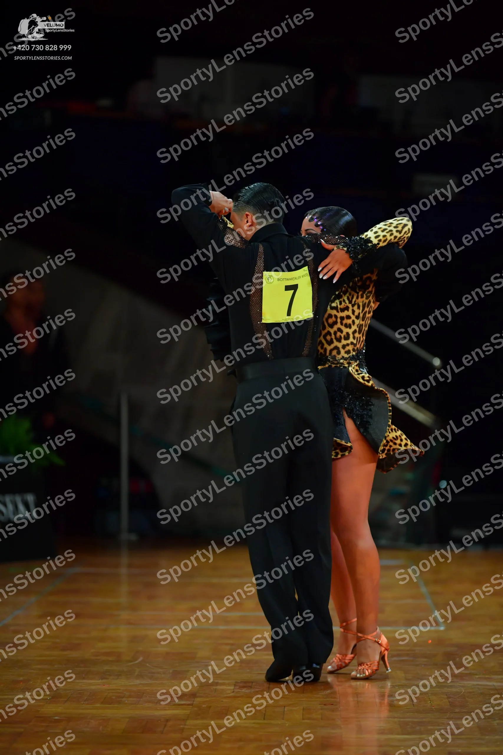 Dancesport competitor: Male dancer: black long-sleeved shirt and black trousers