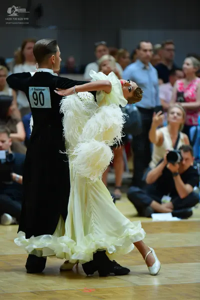 Dancesport competitor #90: Male dancer: black long-sleeved formal top/coat
