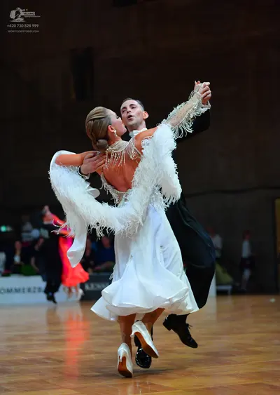 Dancesport competitor: Male dancer: black formal suit with a white shirt