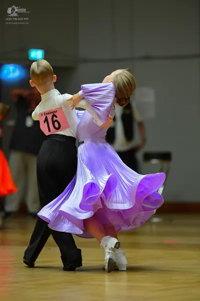 Dancesport competitor #16: Male dancer: white long-sleeve shirt and black trousers