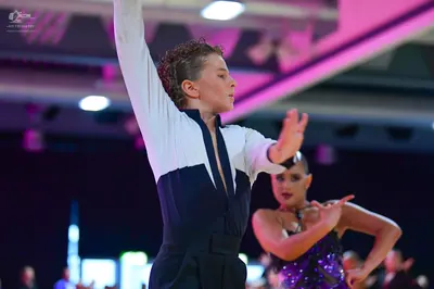 Dancesport competitor: Male dancer: white and black long-sleeved dance shirt