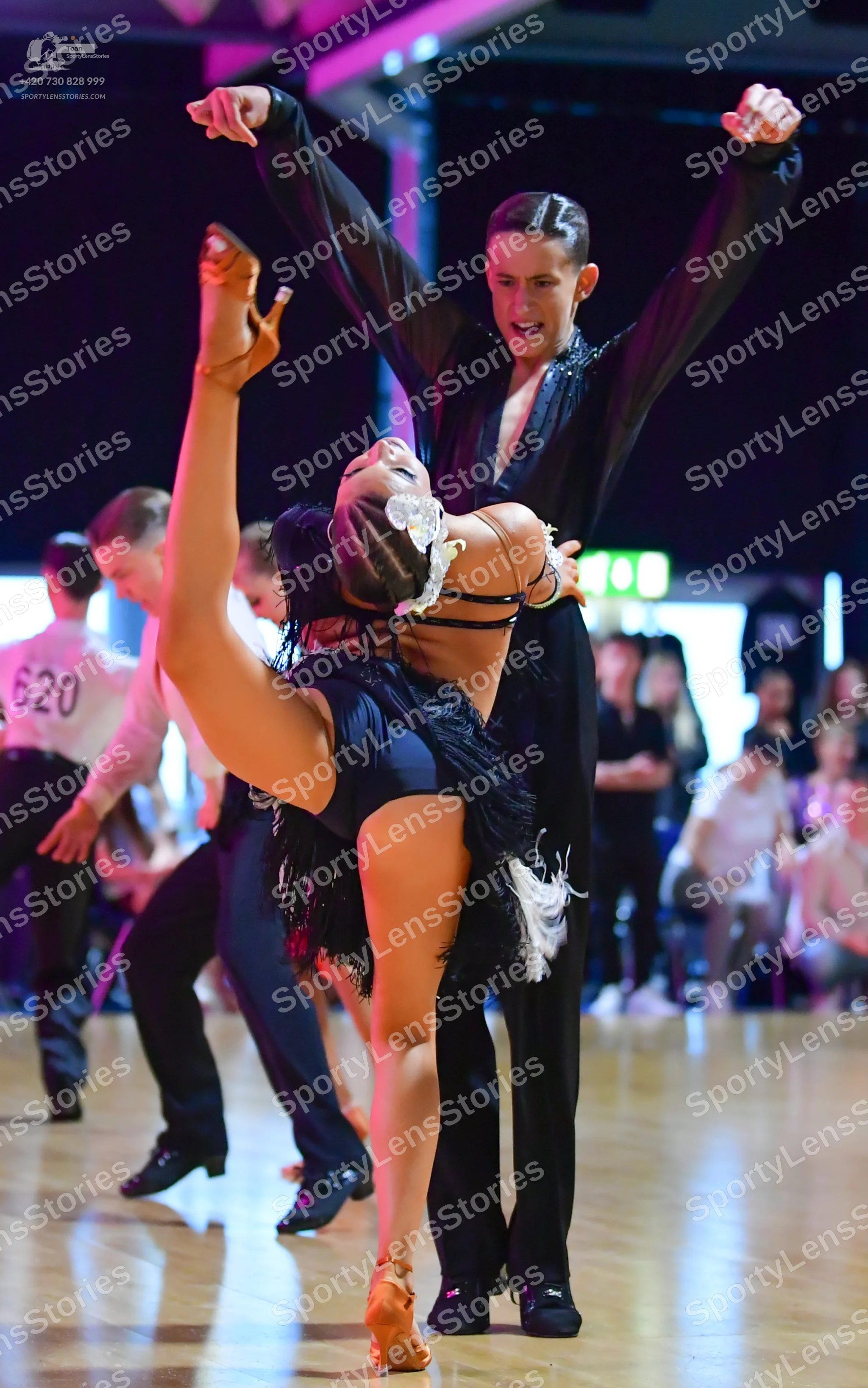 Dancesport competitor #620: Male dancer (620): white long-sleeved shirt and black trousers