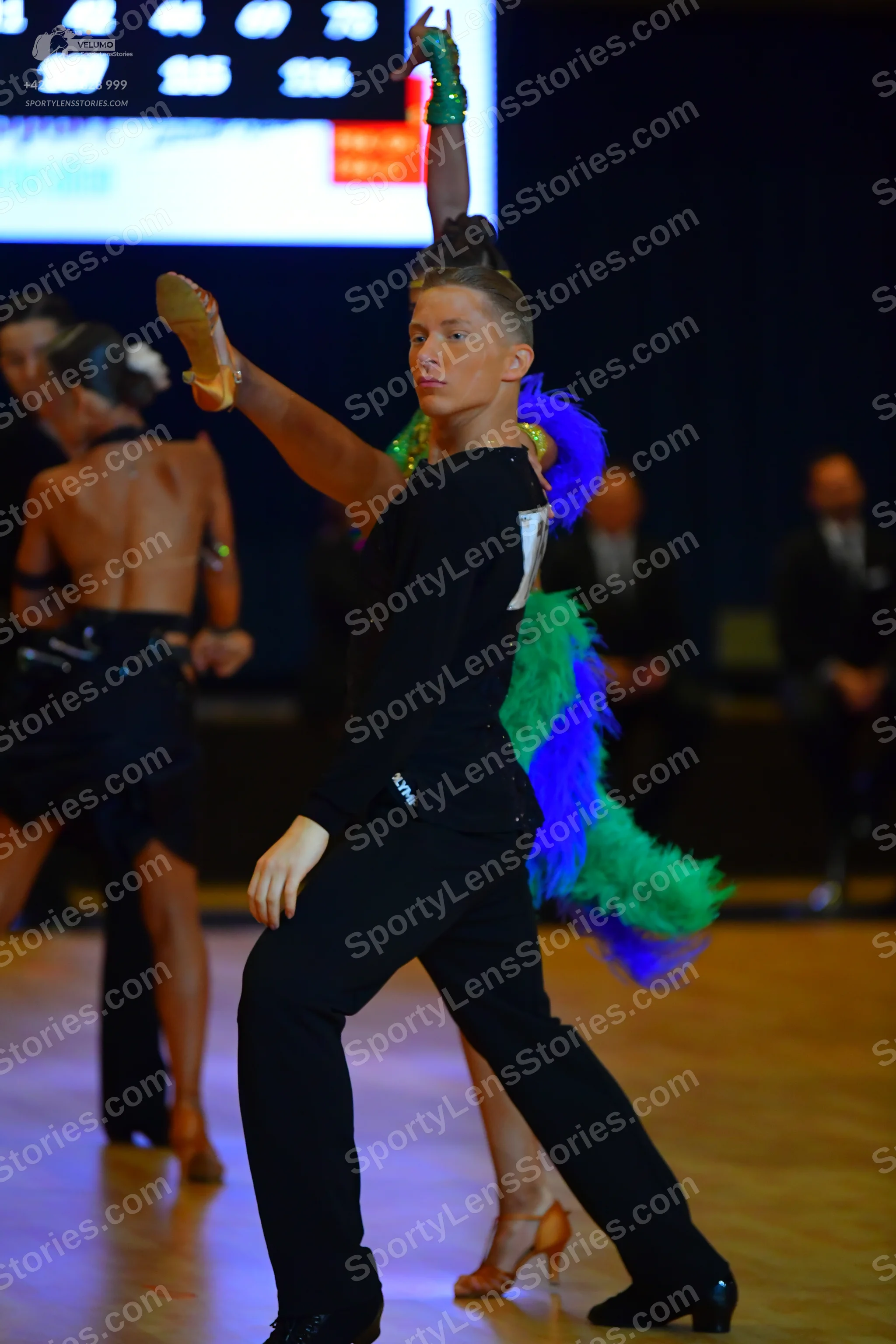 Dancesport competitor: Male dancer: black long-sleeved shirt and black trousers