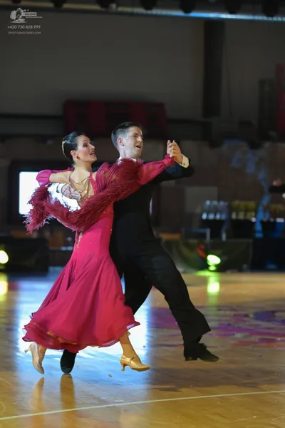 Dancesport competitor: Male dancer: black ballroom suit with black trousers and black dance shoes