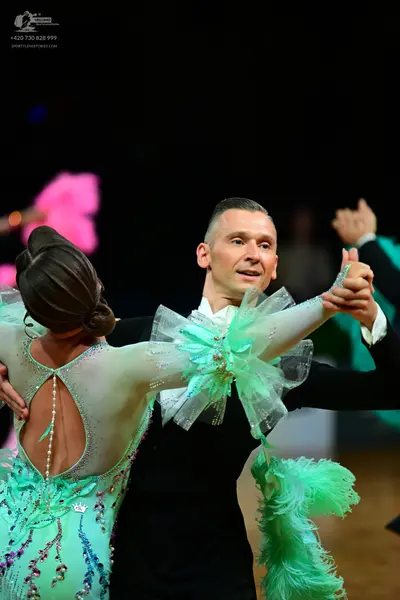 Dancesport competitor: Female dancer: light mint green latin dress with sheer mesh back and sleeves, ad