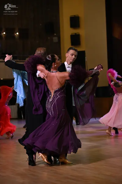 Dancesport competitor: ** Black tailsuit with silver sequin lapels