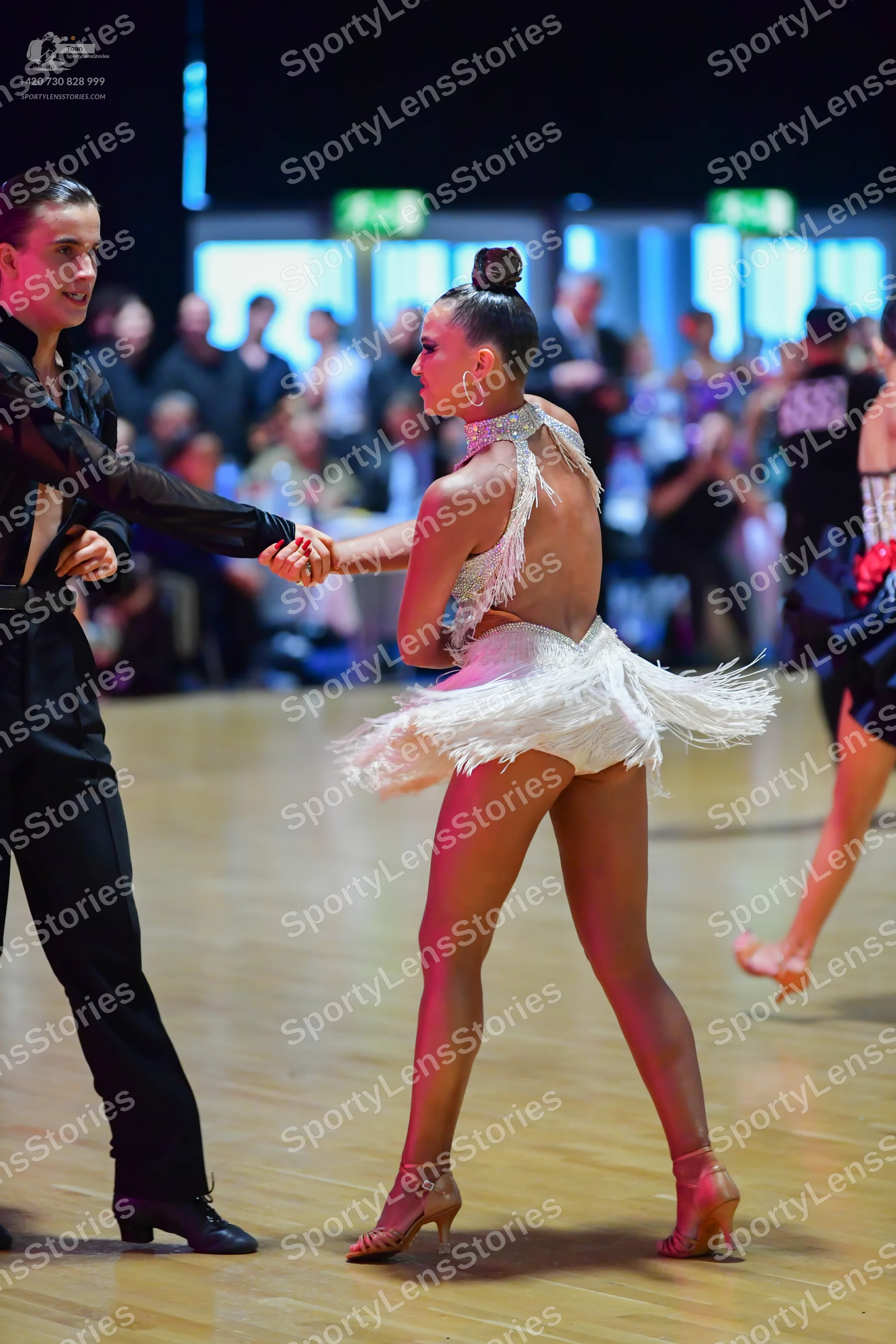 Dancesport competitor: Male dancer: black long-sleeved shirt and black trousers