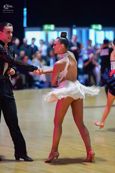 Dancesport competitor: Male dancer: black long-sleeved shirt and black trousers