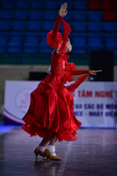 Dancesport competitor: ** Female: Red Latin Dress