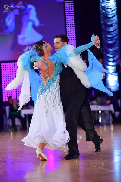 Dancesport competitor: Male dancer: black suit