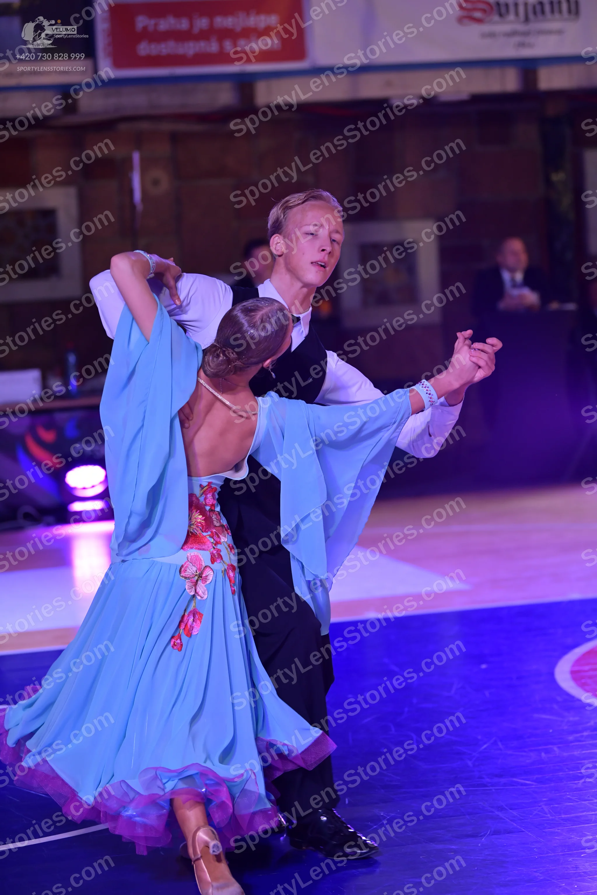 Dancesport competitor: Male dancer: white long-sleeved shirt, black waistcoat, and black trousers