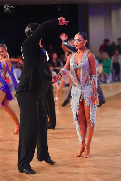 Dancesport competitor: Male dancer: black suit