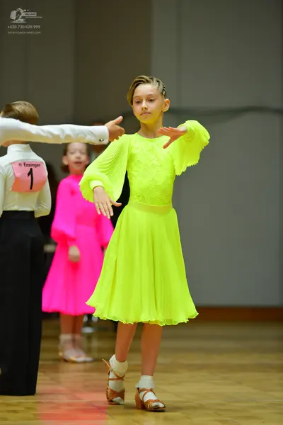 Dancesport competitor: Male dancer: white long-sleeved shirt and black trousers