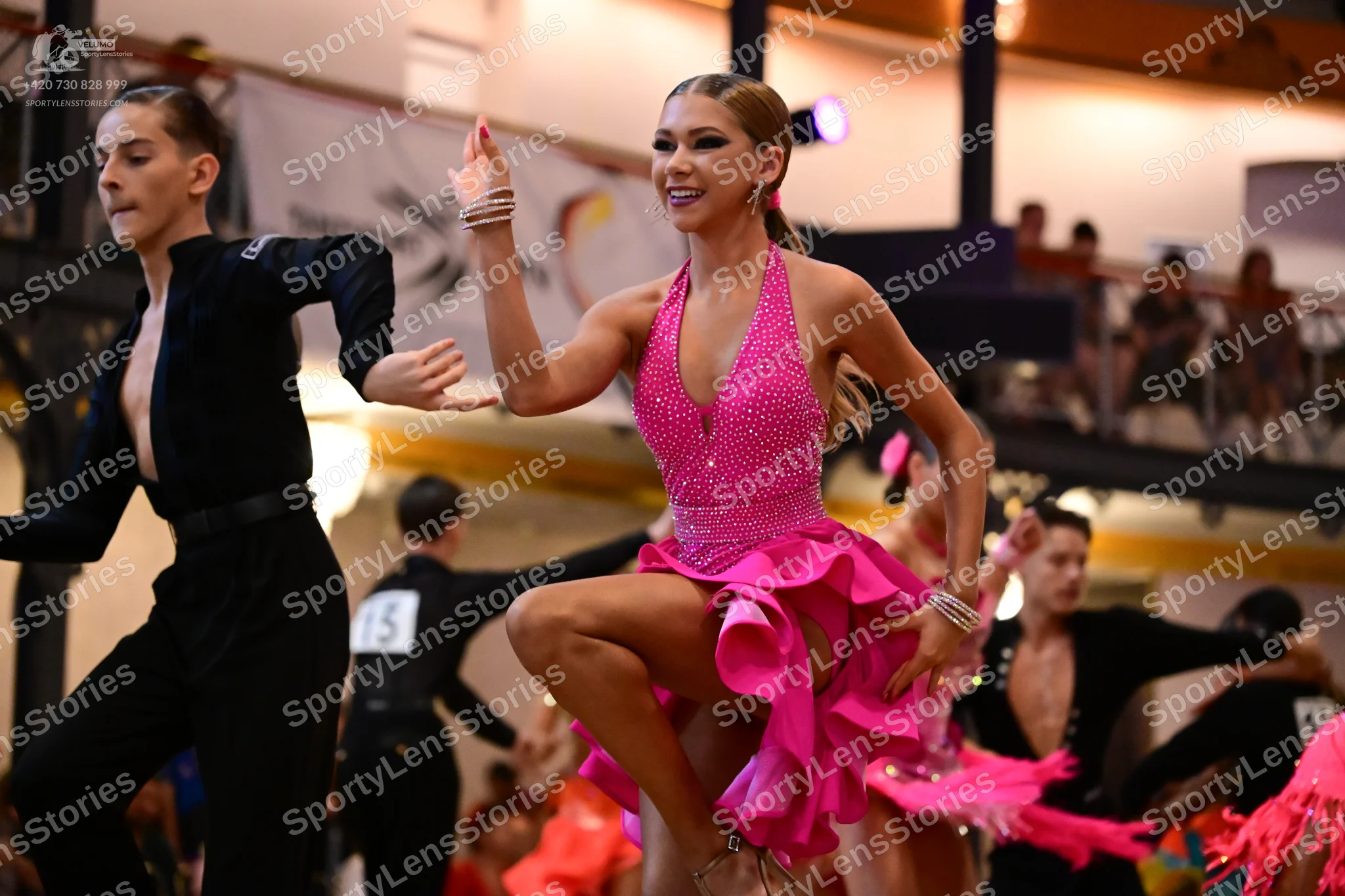 Dancesport competitor #13: Male dancer (foreground): black long-sleeved shirt and black trousers