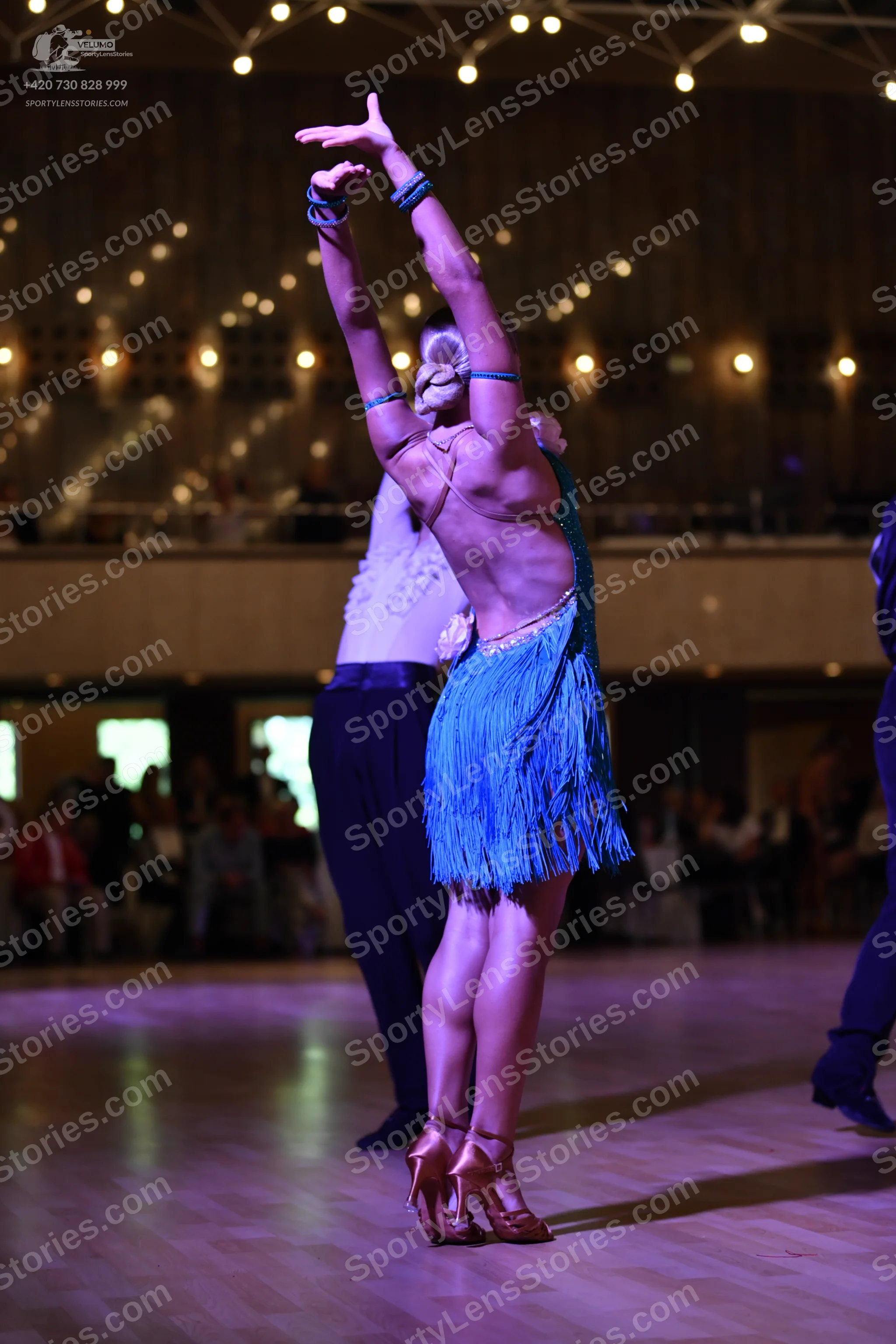Dancesport competitor: **  Shimmering blue and silver sequins latin dress with a dramatic fringe hemlin
