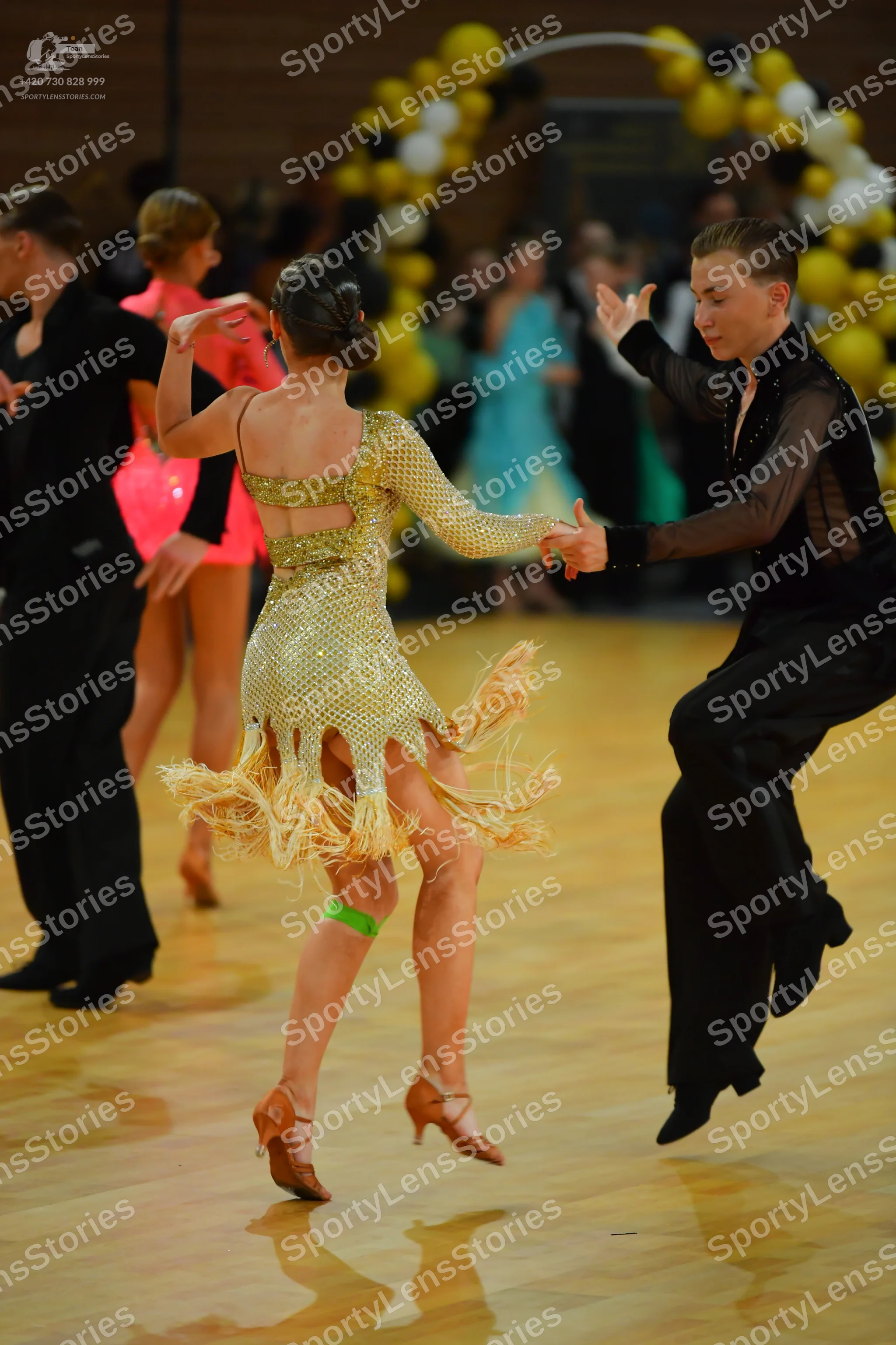 Dancesport competitor: ** Gold Latin dress