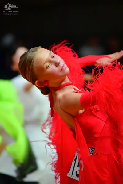 Dancesport competitor #15: Female dancer: red latin dress with red feather fringe
